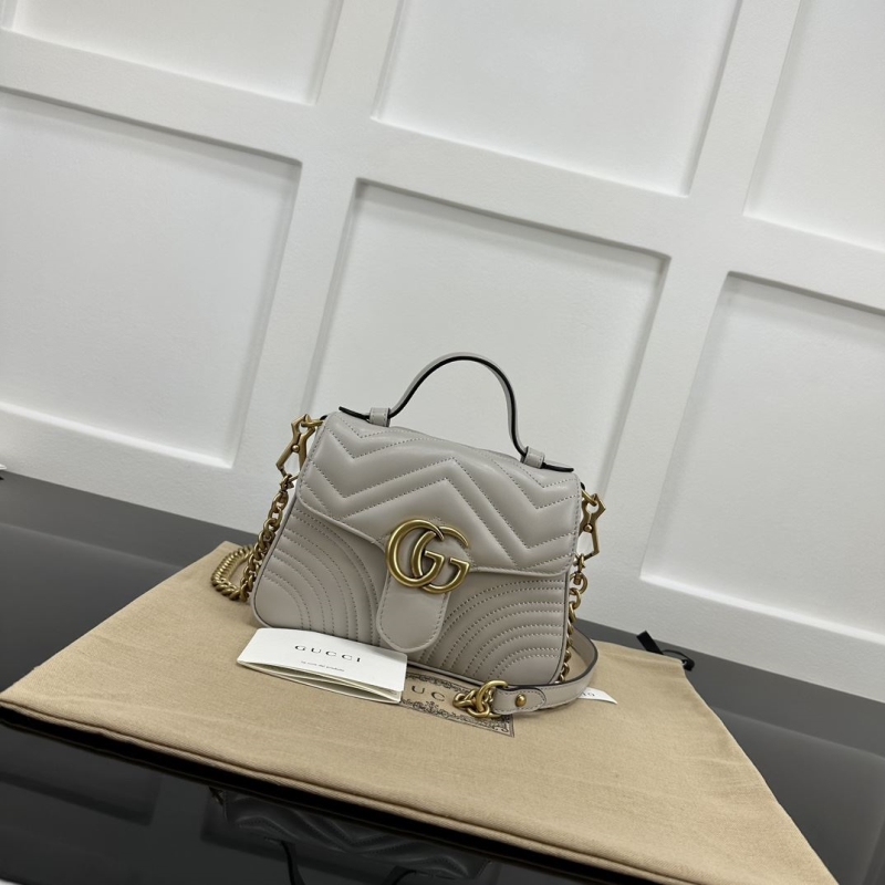 G*u*i top handle bags